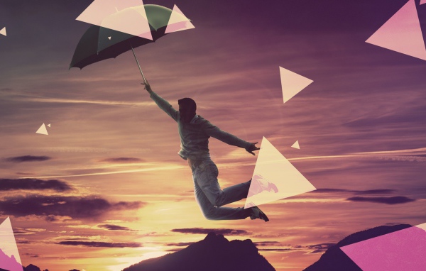 Человек летит на зонтике
