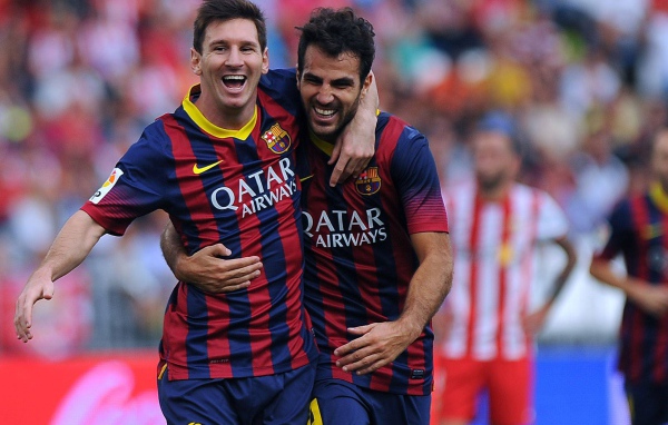 The football players of Barcelona Francesc Fabregas and Lionel Messi