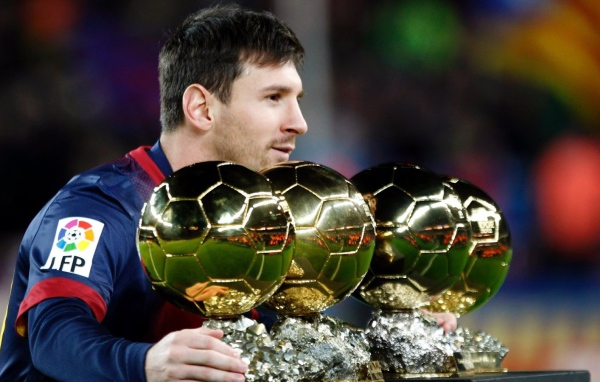 The player of Barcelona Lionel Messi is with his trophies