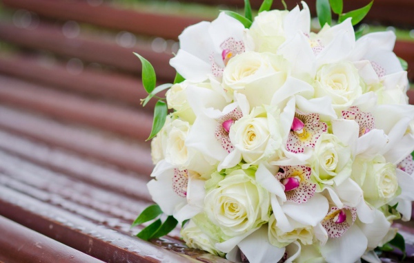 White roses and other flowers in a wedding bouquet