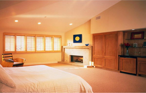 Bedroom with fireplace on a summer residence