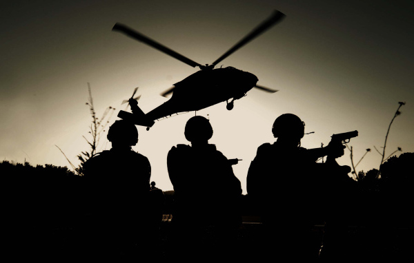 Three SWAT on the background of the helicopter