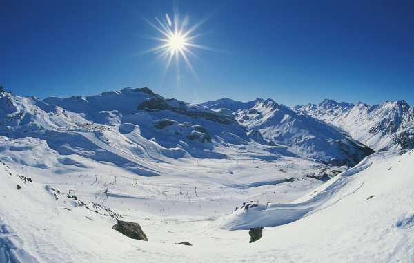Sun in the mountains at the ski resort of Ischgl, Austria