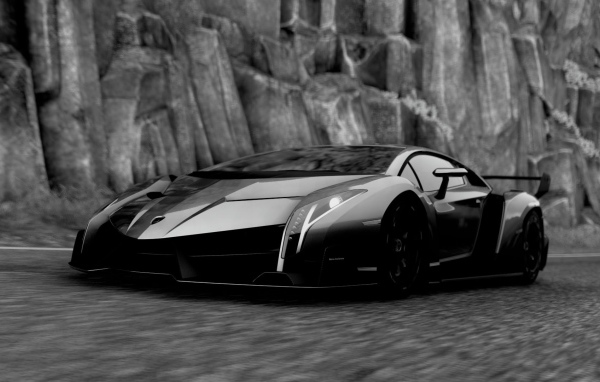 Черный Ламборгини у каменной скалы
