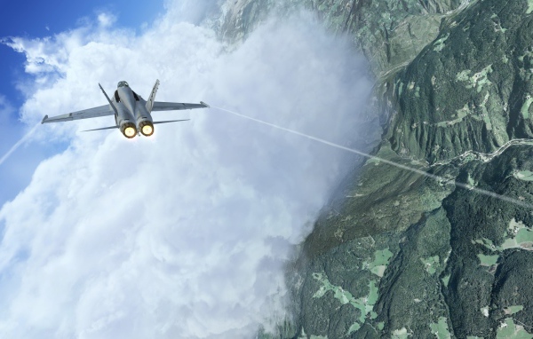 Истребитель летит сквозь облако в горах