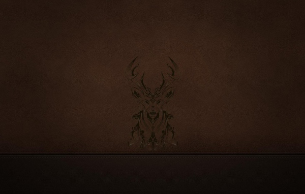 Силуэт оленя на коричневой коже