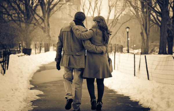 Lovers walk in winter park
