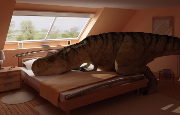 Dinosaur lay on the bed