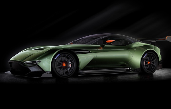Green racing Aston Martin on a black background