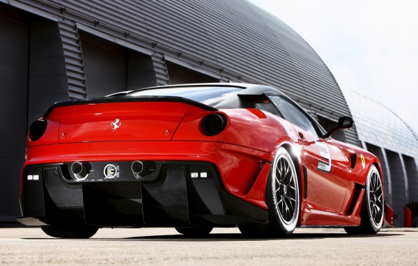 Red Ferrari at the hangar