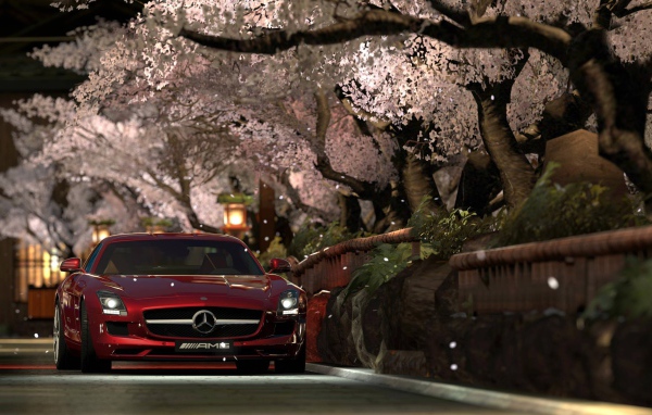 Красный Мерседес Gran Turismo под сенью сакуры