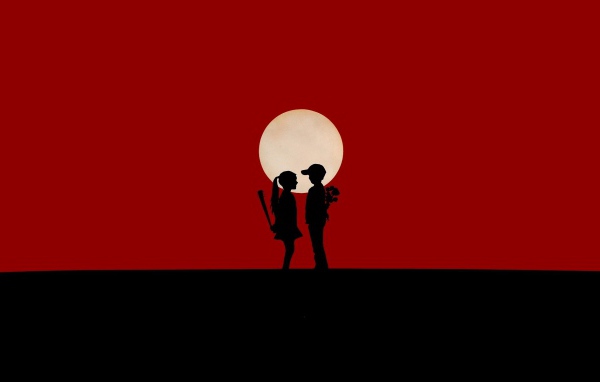 Мальчик и девочка на красном фоне