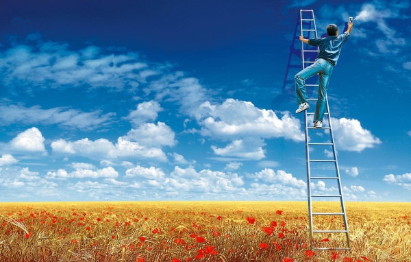 Мужчина рисует облака