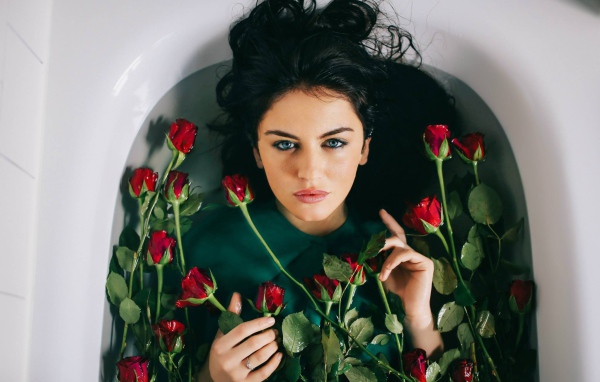 Aurela Skandaj brunette among the roses in the bathroom