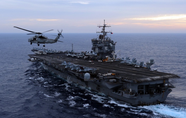 Helicopter on the background of an aircraft carrier