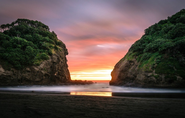 Beautiful sunset between rocks in New Zealand