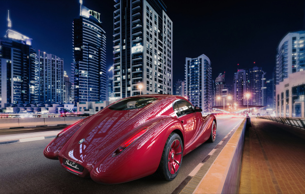 Необычный красный автомобиль Eadon Green Black Cuillin на фоне города 