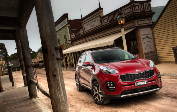 Красный внедорожник  Kia Sportage