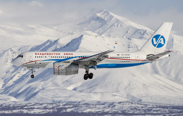 TU 204-300 airline Vladivostok Air flies over the mountains of Altai
