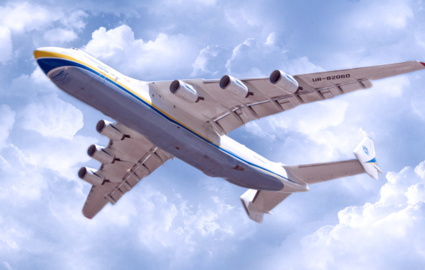 The transport jet AN-225 Mriya flight under the clouds