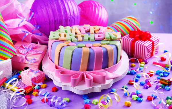 Multicolored cake and decorations for birthday