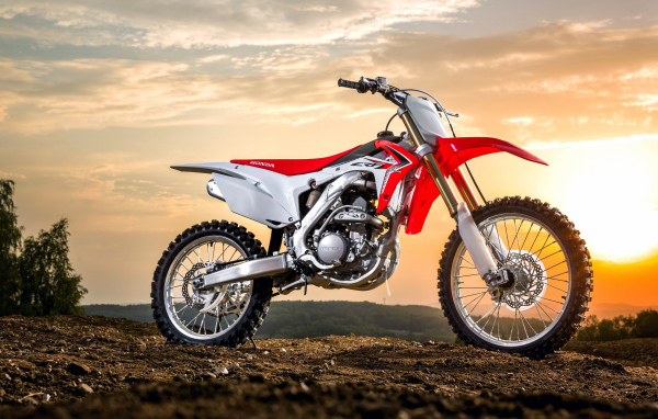 Motorcycle Honda CRF250R on the sunset background