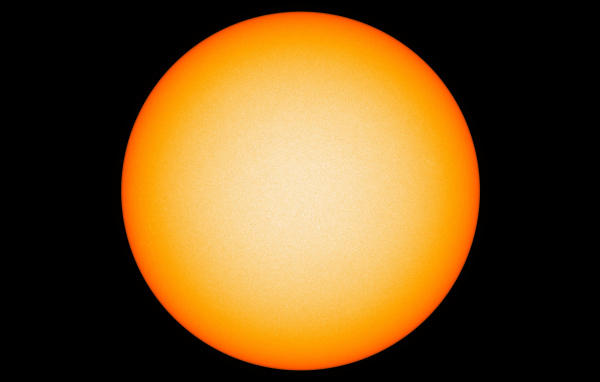 Яркое желтое солнце на черном фоне