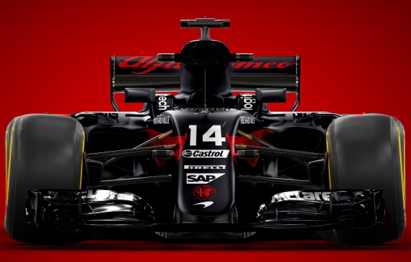 Гоночный автомобиль Formula 1 на красном фоне