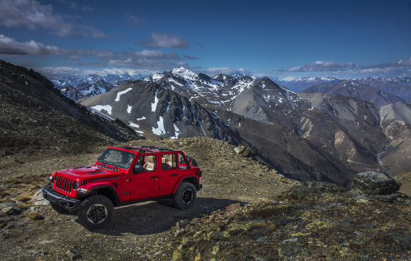 Red Jeep Wrangler in the mountains