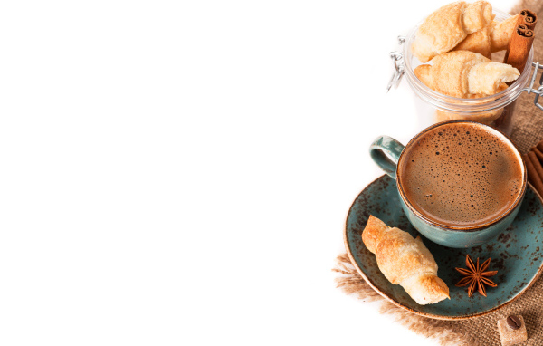 Coffee with croissants and cinnamon on white background