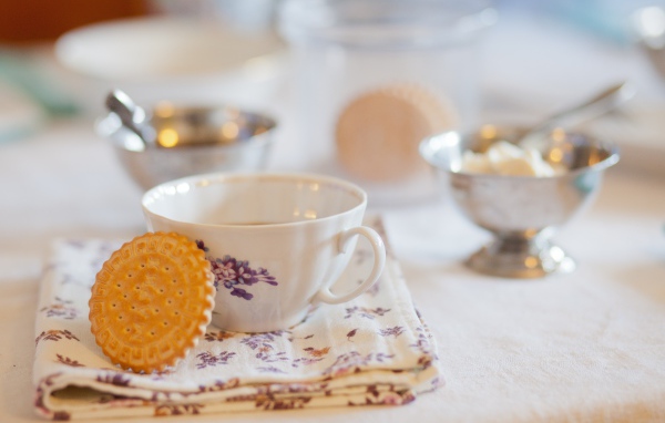 Cup of tea with Maria cookies on the table