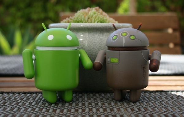 Two android holding hands