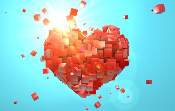 Сердце из красных кубиков на голубом фоне