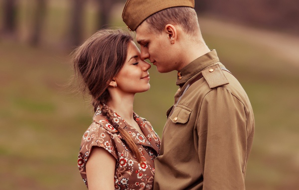 Girl meets soldier with war, retro photo