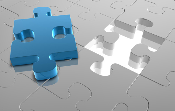 Голубой пазл на сером рисунке 