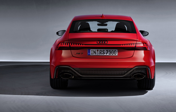 Red 2019 Audi RS 7 Sportback car on a gray background rear view