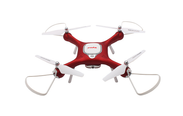 Красный дрон SYMA X25W на белом фоне