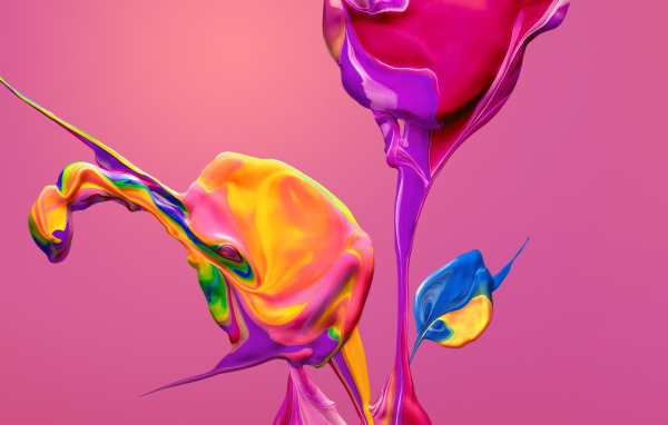 Разноцветные краски смешиваются на розовом фоне