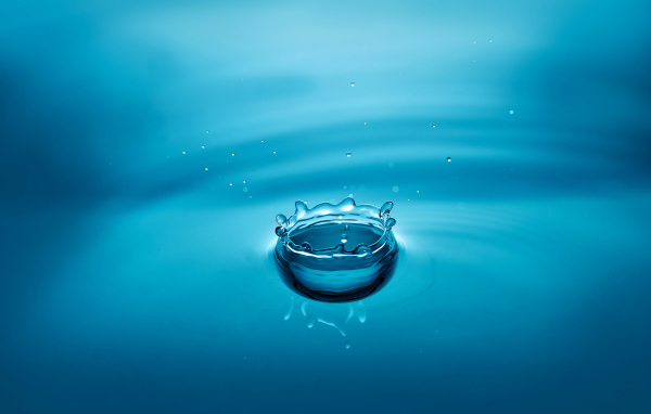 A drop of water in the blue surface