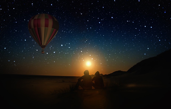 Balloon in the starry sky on the background of the moon