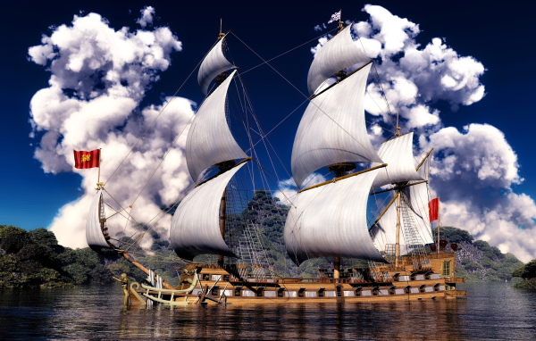 Красивое парусное судно на фоне белых облаков