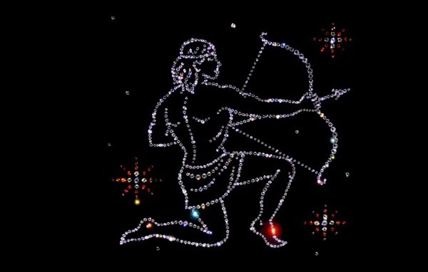 Блестящий знак зодиака стрелец на черном фоне