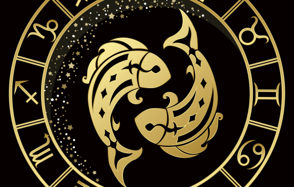 Золотой знак зодиака рыбы на черном фоне