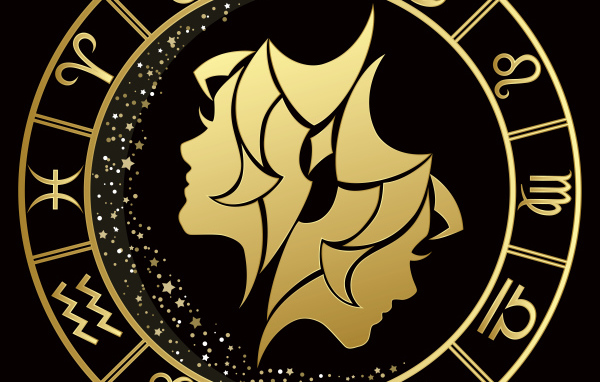 Золотой знак зодиака близнецы на черном фоне