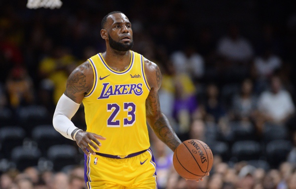 Basketball player LeBron James is a Los Angeles Lakers team player.