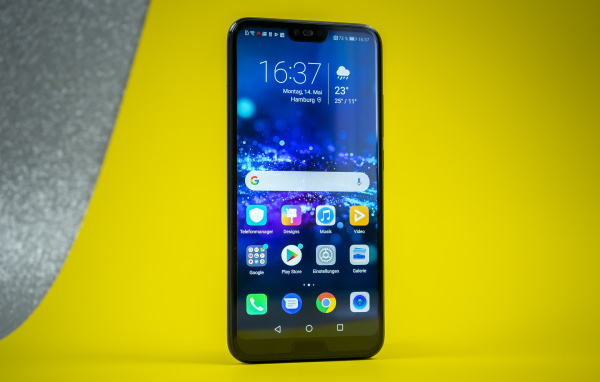 Slim smartphone Honor 10 on a yellow background