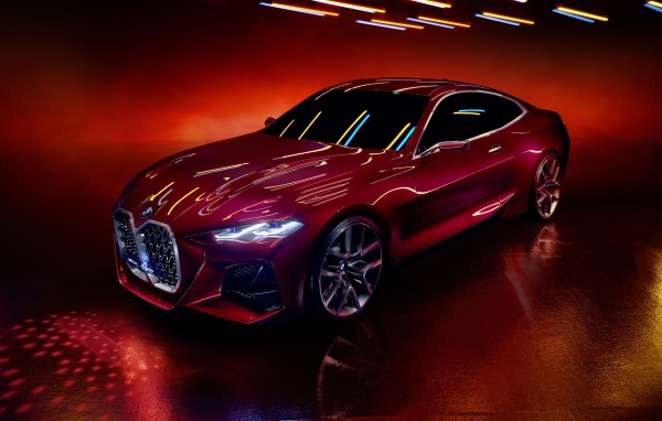 Красный автомобиль BMW Concept 4 2019 года на красном фоне
