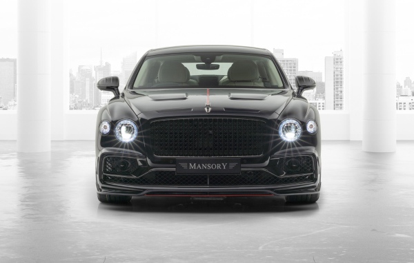 2020 black Mansory Bentley Flying Spur with headlights on