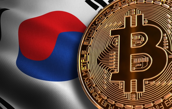 Bitcoin gold coin on the background of the flag of Korea