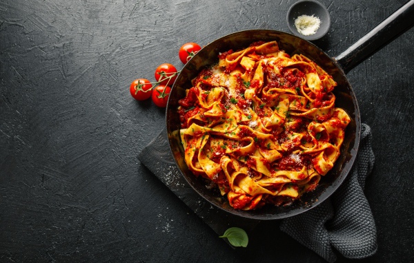 Pasta with sauce in a pan on the table
